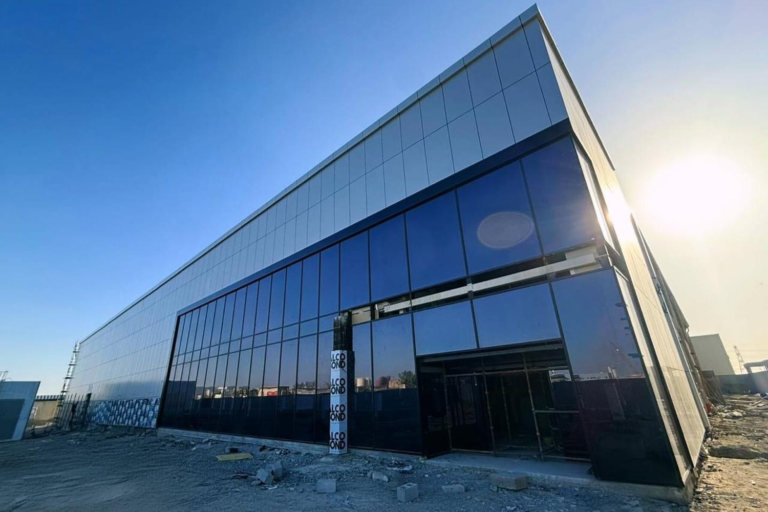 Modern industrial facility with a glass facade